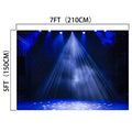 A 7x5FT Stage Spotlight Backdrop Concert Gloomy Night Scenic Photography Background Portrait Studio Props by ideasbackdrop, illuminated by blue stage lights with a starry night pattern, is perfect for photography props. Its wrinkle resistance ensures a smooth and professional appearance in every shot.