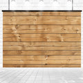 7x5ft Retro Wood Graduate Wall Background Wooden Backdrop Studio Props for Baby Shower Birthday Photography by ideasbackdrop comprised of horizontal wooden planks installed against a white brick backdrop, illuminated by overhead lighting—a perfect wood photography prop.