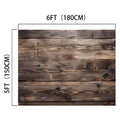 The image shows a 7x5ft Vintage Wood Backdrop Retro Rustic Wooden Floor Background for Photography Photo Booth Video Shoot Studio Props by ideasbackdrop, a wooden panel measuring 6 feet (180 cm) in length and 5 feet (150 cm) in height. The wood has a dark, weathered appearance with visible knots and grain patterns.