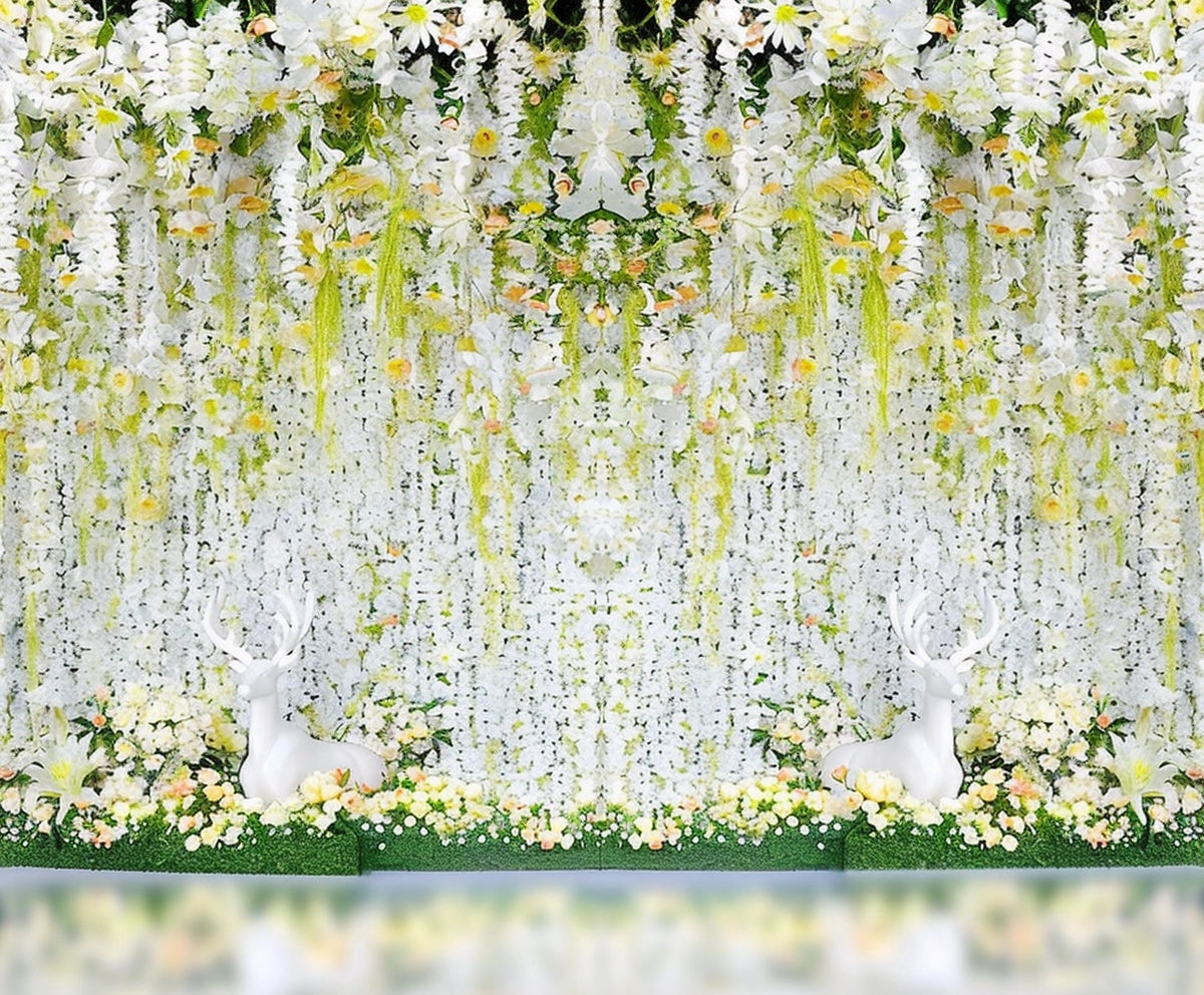A picturesque stage featuring a cascading floral display in white, yellow, and green hues with two white deer statues nestled among the blooms. This Bridal Shower Flower Party Wedding Backdrop-ideasbackdrop arrangement by ideasbackdrop has a symmetrical design, making it perfect for wedding decor.