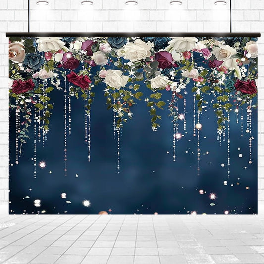 Decorative backdrop featuring an arrangement of roses and greenery with hanging beads and lights against a dark blue background, showcasing detailed floral designs with vibrant hues. Introducing the Bridal Shower Golden Glitter Floral Backdrop by ideasbackdrop.
