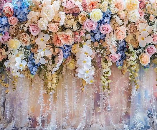 A vibrant floral arrangement featuring a variety of pastel and white flowers, including roses, orchids, and hydrangeas, displayed against a lace fabric backdrop—perfect for photo shoots or event design. Introducing the Bridal Shower Wedding Floral Backdrop -ideasbackdrop by ideasbackdrop.