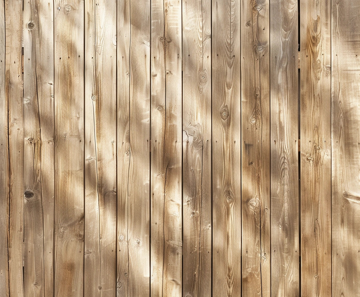 Vertical wooden planks with a light, natural finish are arranged side by side, making an ideal wood wall backdrop. Shadows from nearby objects create a dappled pattern on the surface, perfect for high-resolution printing and ensuring wrinkle resistance. This stunning setup can be effortlessly achieved using the Brown Wood Backdrops for Photography Vintage Brown Background Baby Shower Birthday Photo Booth Studio Props by ideasbackdrop.