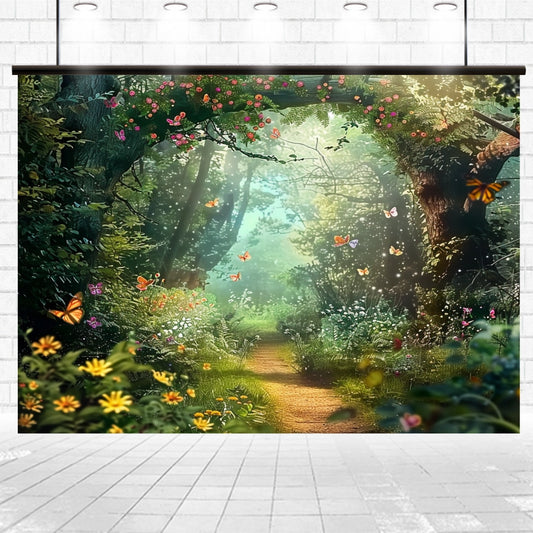 An Enchanted Forest Photography Flower Backdrop by ideasbackdrop depicting a sunlit forest path with colorful butterflies and flowers, mounted on a white brick wall. Perfect for adding charm to any celebratory event decoration.