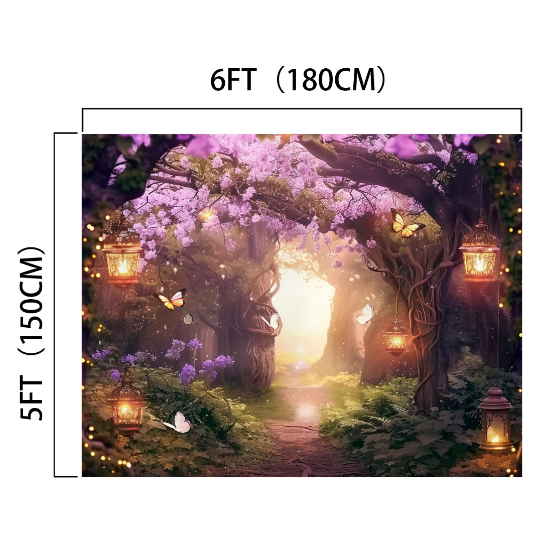 A 6-foot by 5-foot HD Vivid Floral Backdrop featuring a fairy-tale scene with lanterns hanging from trees, glowing butterflies, and a path leading to a bright light surrounded by vibrant garden flowers is called the Fairy Enchanted Fairytale Flower Backdrop -ideasbackdrop by ideasbackdrop.