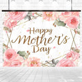 A Mother's Day backdrop featuring a banner that reads "Happy Mother's Day" in gold glitter text, surrounded by pink and peach roses with green leaves. The white background has subtle gold accents and a brick texture, creating a perfect setting for vivid photo ops. This is the Floral Gold Dots Happy Mother's Day Backdrop-ideasbackdrop by ideasbackdrop.