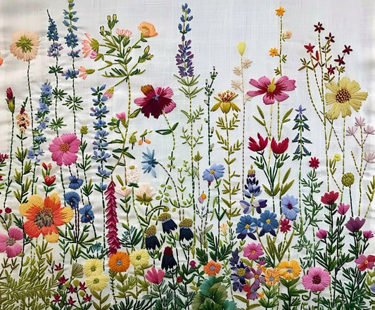 A detailed embroidery of various colorful wildflowers and plants on a white fabric background creates a lifelike floral canvas, transforming the material into the Floral Plant Photo Props Flower Backdrop by ideasbackdrop.