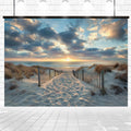 A sandy path flanked by wooden fences leads to a beach with calm waves and a sunset sky filled with scattered clouds, creating a Hawaii Sun Sky Ocean Photo Beach Backdrop - ideasbackdrop perfect for photography.