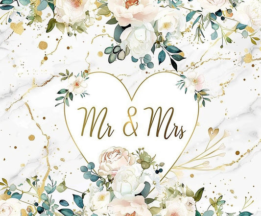 A floral wedding card with "Mr & Mrs" written inside a heart-shaped design. The Mr and Mrs Floral Hearts Wedding Backdrop-ideasbackdrop by ideasbackdrop features white and pink flowers, green leaves, and gold accents on a white marble background, enhanced by high-definition visuals to capture every detail of the wedding theme beautifully.