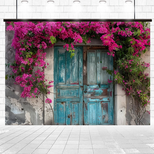 A pair of distressed teal wooden doors set into an old wall with vibrant pink bougainvillea cascading over the entrance creates a vivid Spring Flowers Old Wood Door Backdrop-ideasbackdrop, perfect for home decor enthusiasts seeking a realistic design by ideasbackdrop.