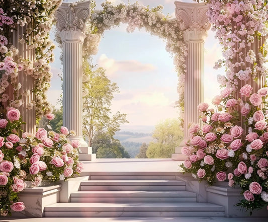 An elegant stone arch adorned with pink and white flowers opens to a scenic landscape, creating a captivating atmosphere with trees and distant hills under a partly cloudy sky. Steps leading up add to the grandeur of the setup, enhanced by the HD vivid floral imagery in the backdrop provided by the Pink Floral Stone Wall Arch Flower Backdrop from ideasbackdrop.