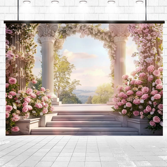 A classical stone veranda adorned with pink roses and ornate columns overlooks a serene landscape under a bright sky, enhanced by vibrant hues of the Pink Floral Stone Wall Arch Flower Backdrop by ideasbackdrop.