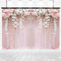 A Pink Flower Rose Blossom Wedding Backdrop-ideasbackdrop by ideasbackdrop, adorned with hanging white orchids, serves as the perfect wedding backdrop against a pristine white brick wall and tiled floor background.