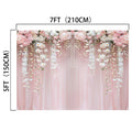 A 7ft by 5ft ideasbackdrop Pink Flower Rose Blossom Wedding Backdrop featuring pink and white flowers arranged at the top and gracefully hanging down, set against a light pink curtain. The vibrant colors make it perfect for any wedding theme.