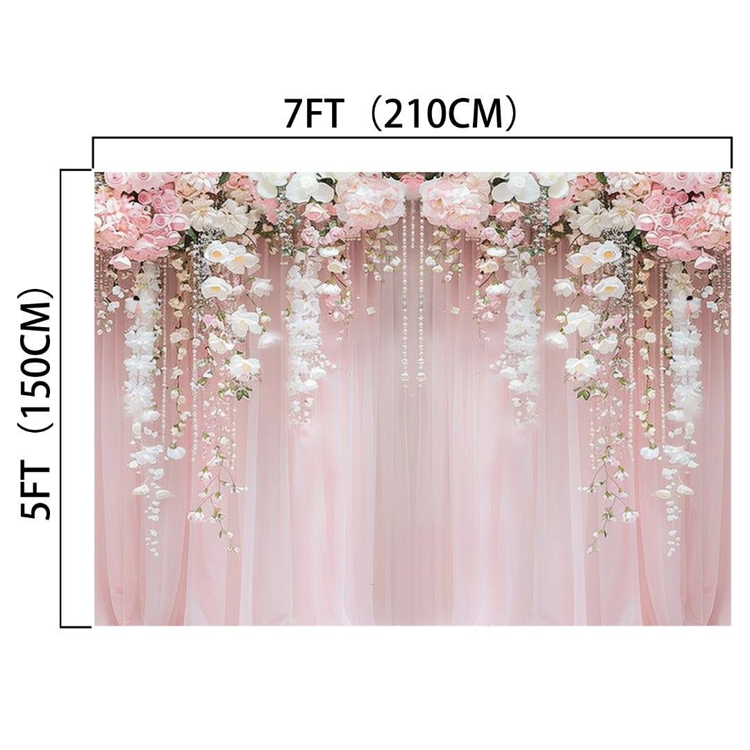 A 7ft by 5ft ideasbackdrop Pink Flower Rose Blossom Wedding Backdrop featuring pink and white flowers arranged at the top and gracefully hanging down, set against a light pink curtain. The vibrant colors make it perfect for any wedding theme.