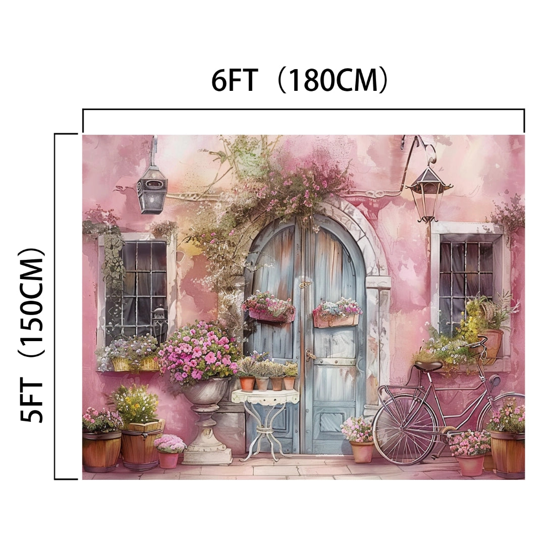 A 6ft by 5ft HD Pink Wall Flower Spring Nature Door Backdrop-ideasbackdrop featuring a rustic blue door surrounded by various potted flowers and plants, with a vintage bicycle parked nearby. The photo backdrop has a pinkish tone and wall lamps, perfect for adding dramatic decor to any setting. Brand Name: ideasbackdrop