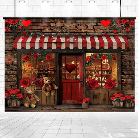 A storefront with a striped red and white awning, decorated with red roses and heart accents, creating an elegant decor. The Red Rose Floral Brick Wall Door Backdrop-ideasbackdrop by ideasbackdrop enhances the charm, while two teddy bears sit outside.