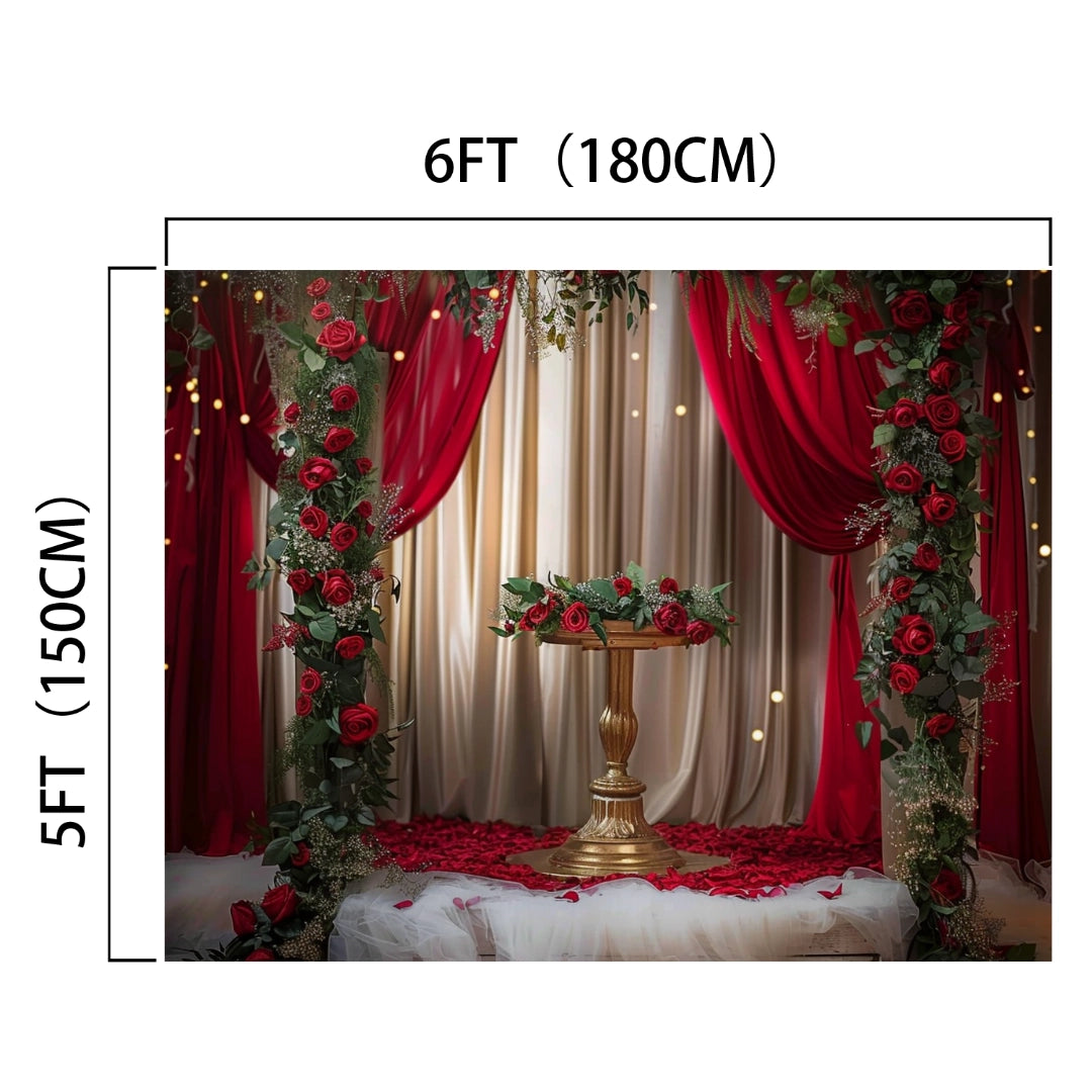 A decorated space with red curtains, the Red Floral Wedding Bridal Shower Backdrop - ideasbackdrop by ideasbackdrop, and a small table in the center. The space measures 6 feet by 5 feet (180 cm by 150 cm).