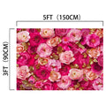 A Red Rose Spring Mother's Day Floral Backdrop -ideasbackdrop, measuring 5 feet by 3 feet, featuring an array of pink, red, and gold roses and other lifelike flowers.