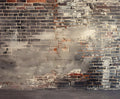 A Vintage Distressed Brick Wall Backdrop for Photography Portrait Background Studio Props from ideasbackdrop with sections of varying shades and areas of gray and white paint splatters. The surface has visible cracks and chipped bricks, perfect for photo studio photography or high-resolution printing.
