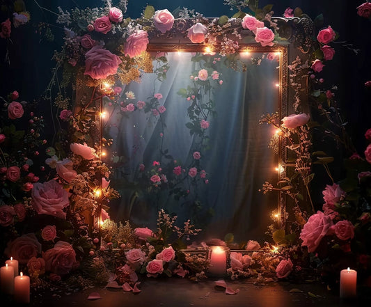 A decorative mirror is surrounded by pink roses, illuminated by string lights and candles. Fallen petals are scattered at the base, set against the Romantic Bridal Shower Flower Backdrop -ideasbackdrop that enhances the scene with its dark, vivid display of more roses and foliage.