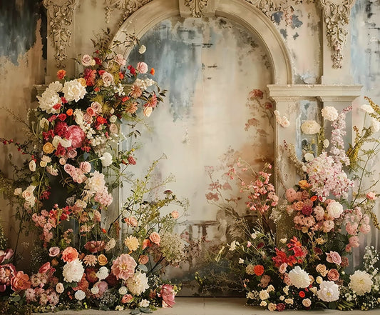 An ornate archway with weathered paint is adorned with an abundance of various colorful flowers and greenery, creating a lush and vibrant floral arrangement, offering stunning high-definition detail that enhances its floral elegance—a perfect scene for the Romantic Wedding Bridal Shower Flower Backdrop by ideasbackdrop.