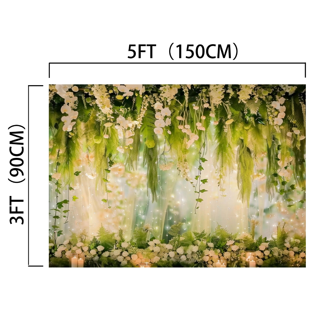 The ideasbackdrop Romantic Floral Weddings Photography Backdrop -ideasbackdrop is a decorative backdrop measuring 5 feet by 3 feet featuring an arrangement of green foliage and white flowers, with string lights interwoven throughout the display, perfect for adding floral splendor to your event decor.