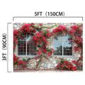 A stone wall with two arched windows, covered by red flowers and green vines, creates a captivating ideasbackdrop Romantic Red Blossom Flower House Windows Backdrop-ideasbackdrop. The dimensions of the wall are noted as 5 feet (150 cm) wide and 3 feet (90 cm) tall, making it ideal for realistic window views in studio photography.