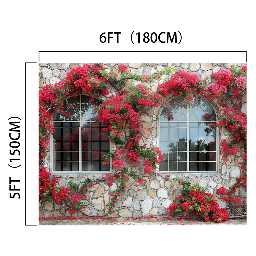 Stone wall with two arched windows, each covered in red flowering vines, creating a realistic window view. Image dimensions are 6 feet (180 cm) wide and 5 feet (150 cm) tall. Perfect for studio photography or as an HD window backdrop. For a romantic and enchanting scene, use the Romantic Red Blossom Flower House Windows Backdrop-ideasbackdrop by ideasbackdrop.