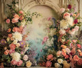 A decorative archway adorned with a variety of flowers in pink, white, peach, and purple hues creates an enchanting scene perfect for professional photo shoots. The background features the Rose Background Bridal Shower Flower Backdrop - ideasbackdrop enhanced with soft-focus floral elegance.