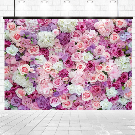A wall covered with an assortment of pink, purple, and white flowers, including roses and hydrangeas, creates a romantic atmosphere in an ornate floral arrangement, perfect for elegant receptions or as a Mother's Day Flower Photography Rose Floral Backdrop - ideasbackdrop by ideasbackdrop.