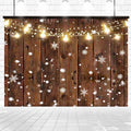 Wooden backdrop decorated with string lights and snowflakes, set against a white tiled floor and brick wall. Snow is falling, creating a festive and cozy winter scene with a vintage design that adds a nostalgic touch. The **Rustic Glitter Background Wood Backdrop-ideasbackdrop** from **ideasbackdrop** enhances the overall ambiance perfectly.
