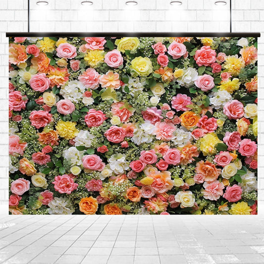 A wall covered with a dense arrangement of colorful roses and other flowers in shades of pink, yellow, white, and green creates a stunning floral backdrop against a tiled floor and wall background, perfect for whimsical weddings or fantasy-themed parties. This effect can be beautifully achieved using the Spring Photography Valentine Flower Backdrop by ideasbackdrop.
