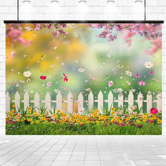 A bright and colorful scene of a flower garden with a white picket fence, blooming flowers, and falling petals set against a blurred green background provides the perfect Spring Flowers Kids Birthday Pink Floral Backdrop - ideasbackdrop for your next virtual meeting.