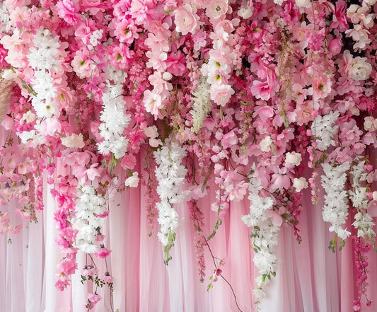 A romantic setting at weddings, featuring a realistic floral display with an abundance of pink and white flowers cascading down, set against the Spring Pink Rose Romantic Flower Backdrop by ideasbackdrop.