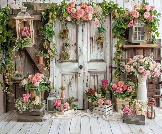 A rustic wooden door and ladder are adorned with various pink and white flowers, greenery, lanterns, and vases, creating a charming floral display that serves as a Spring Rose Floral Wooden Door Flower Backdrop -ideasbackdrop from ideasbackdrop.