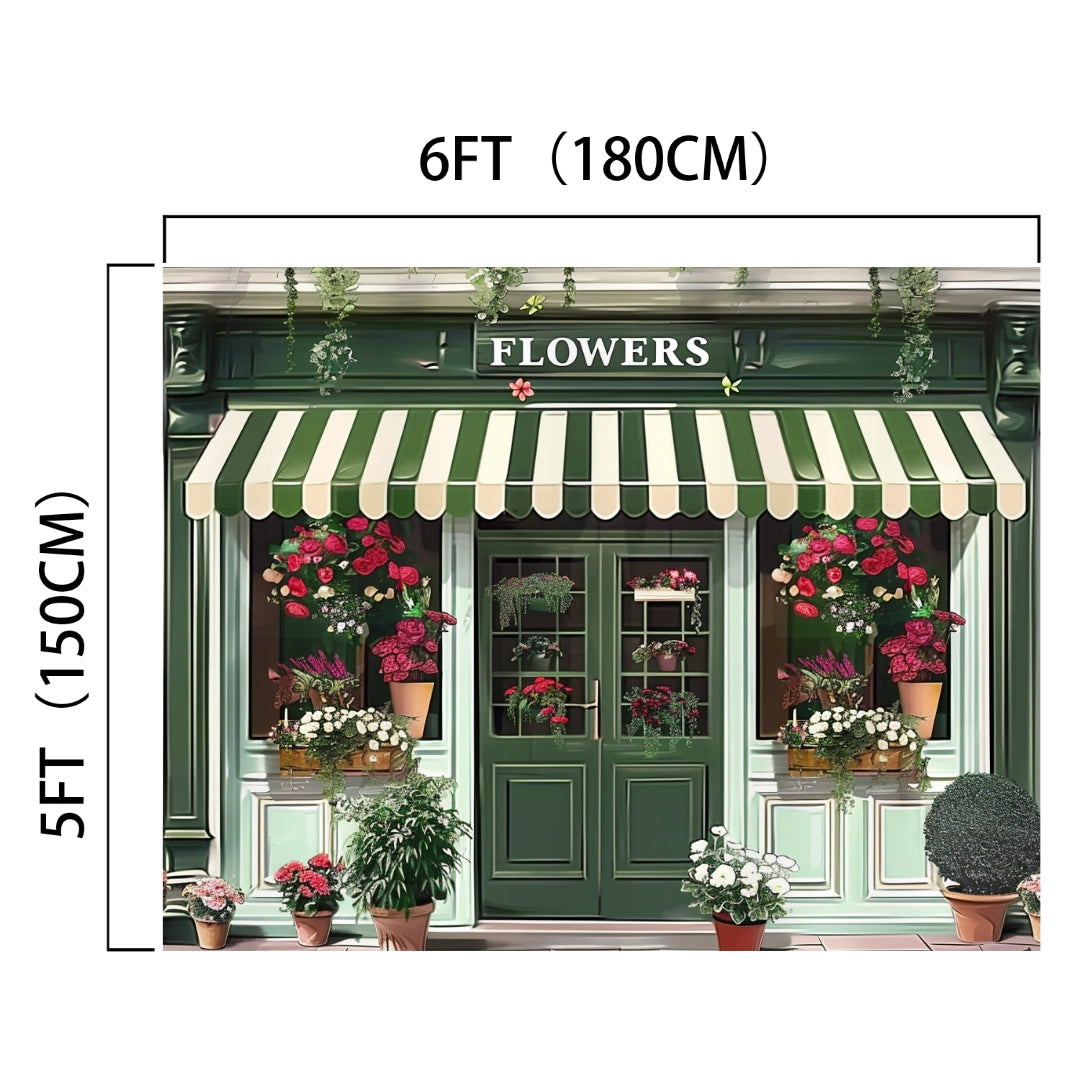 A green storefront with a striped awning labeled "FLOWERS," adorned with various potted plants and flowers, captures the essence beautifully. Bathed in natural light, this 6-foot (180 cm) wide and 5-foot (150 cm) tall scene looks like a Spring Flower Market Bloom Window Backdrop-ideasbackdrop from ideasbackdrop, bringing high-resolution imagery to life.