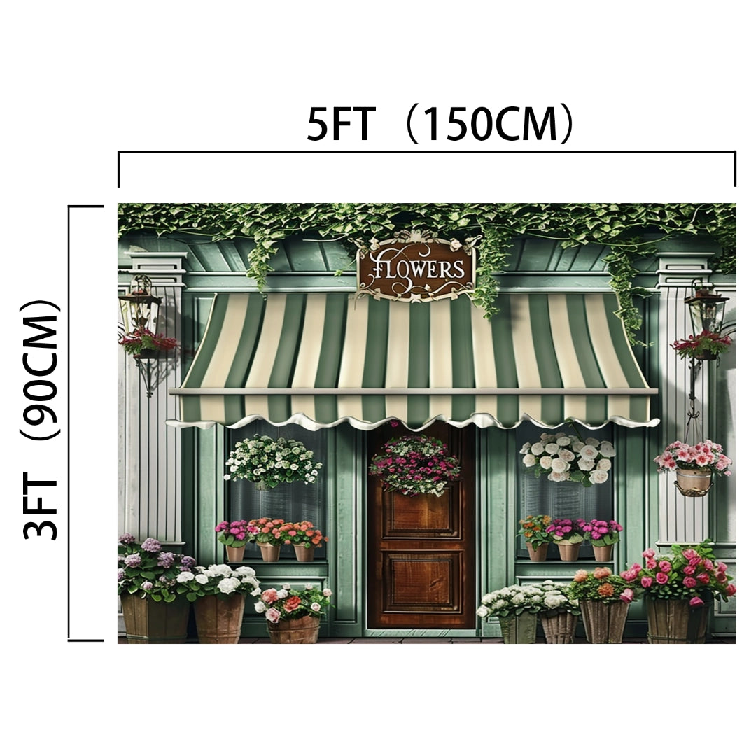 A shop entrance with a green and white striped awning, labeled "Flowers," surrounded by various potted plants and flowers, features a realistic design with vivid colors. The Spring Flowers Store Wood Door Backdrop-ideasbackdrop from ideasbackdrop stands out, measuring 5 feet by 3 feet.