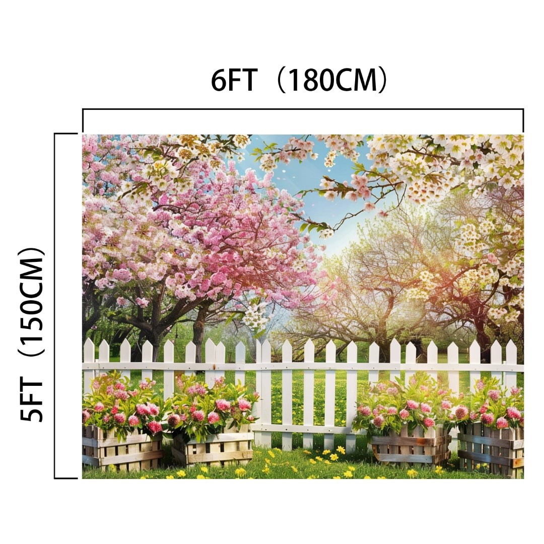 Backdrop featuring a white picket fence with flower boxes and blooming trees in a lush garden, perfect for enhancing your living space; dimensions are labeled as 6 feet (180 cm) wide and 5 feet (150 cm) tall. The product name is Spring White Forest Tree Flower Backdrop -ideasbackdrop by the brand ideasbackdrop.