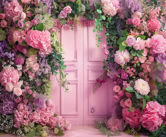 A pink door is surrounded by a lush arrangement of various pink and purple flowers, including roses, peonies, and hydrangeas, set against a Wedding Photography Scenery Flower Backdrop -ideasbackdrop by ideasbackdrop.