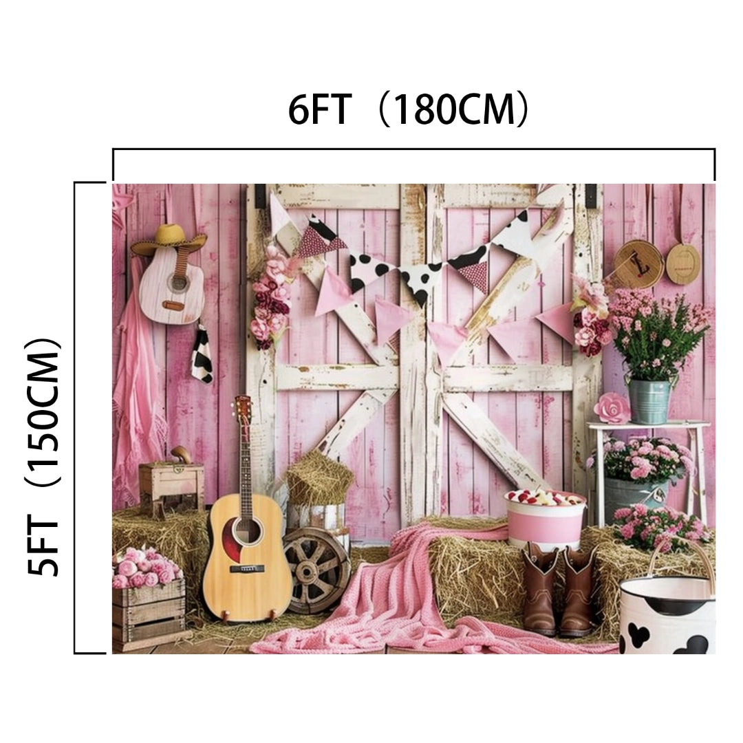 A rustic beauty backdrop with pink and white decorations, featuring guitars, hay bales, flowers, and assorted country-themed items against a pink wooden backdrop measuring 6 feet by 5 feet. The Western Cowgirl Wild West Rustic Barn Backdrop-ideasbackdrop by ideasbackdrop adds a charming countryside vibe to the whole setup.
