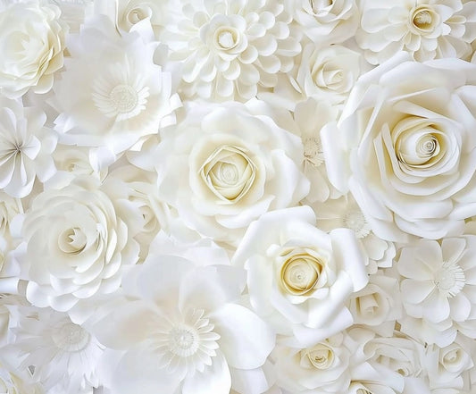 A close-up of numerous white paper flowers of varying sizes and shapes, arranged together to create a dense, textured display—perfect for sophisticated wedding decor. This is the White Flower Bridal Photos Wedding Backdrop-ideasbackdrop from ideasbackdrop.