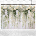 A decorative White Rose Floral Baby Girl Birthday Flower Backdrop -ideasbackdrop with cascading white flowers and green foliage against a bright, light-colored tiled wall, perfect for bridal showers or fashion shoots.