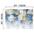 White Blue Rose Party Floral Backdrop by ideasbackdrop, measuring 5 feet (150 cm) wide and 3 feet (90 cm) tall, perfect for photographers capturing stunning portraits, adorned with white and blue flowers and delicate greenery.