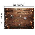 A 7ft by 5ft Wood Photo Backdrop Snowflake Brown Wooden Wall Background Photography for Party Wedding Baby Photoshoot by ideasbackdrop, decorated with string lights and snowflakes, perfect for capturing stunning photos with high-resolution printing.