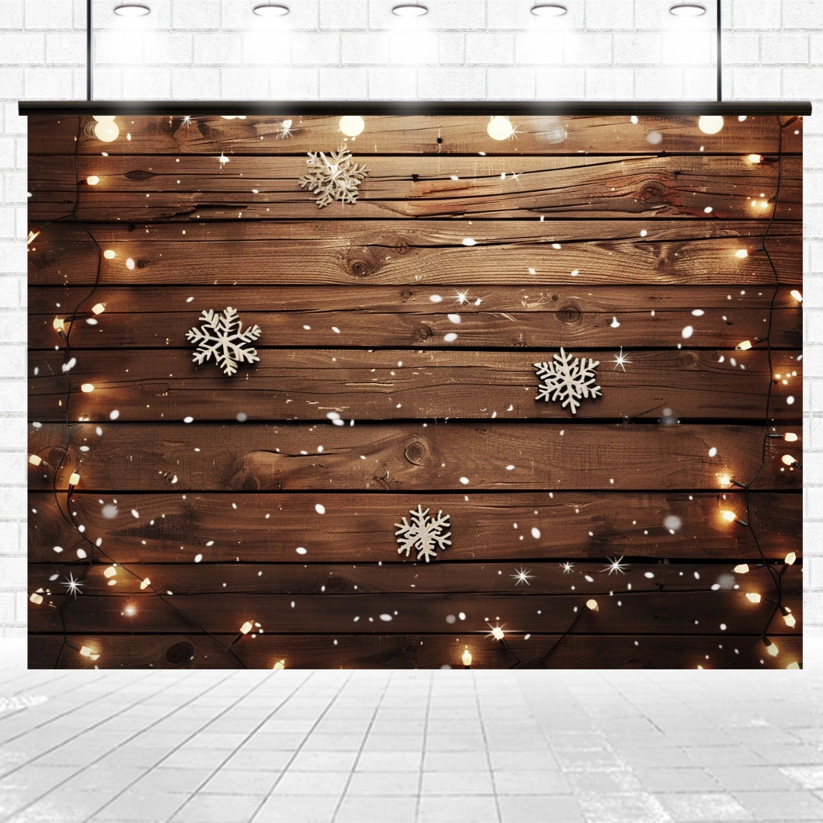Vintage wooden backdrop decorated with string lights and snowflakes, set in a white-tiled room with spotlights above featuring the ideasbackdrop Wood Photo Backdrop Snowflake Brown Wooden Wall Background Photography for Party Wedding Baby Photoshoot.