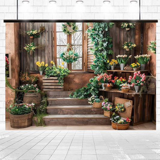 A rustic flower shop with various colorful flowers in pots, baskets, and wooden crates displayed around wooden stairs and windows with greenery, creating a perfect HD floral backdrop for photography at events—the Wooden Window Garden Grass Floral Backdrop-ideasbackdrop by ideasbackdrop.